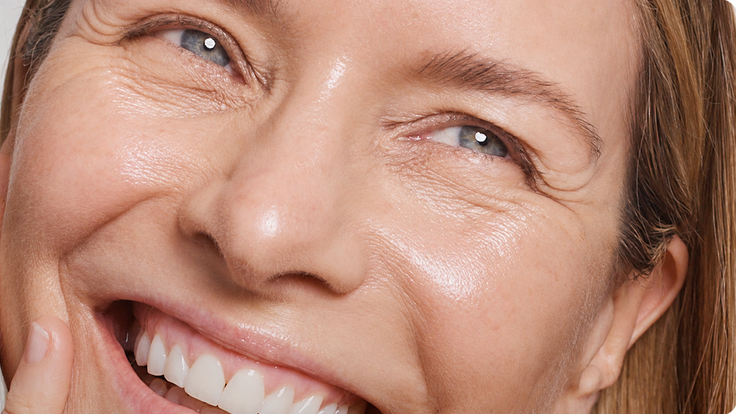 Woman displaying fresh, luminous and hydrated-looking skin following a personalised Hydrafacial treatment.
